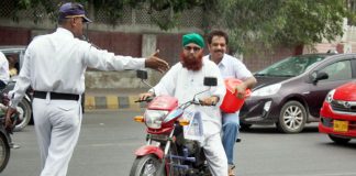 'No Helmet, No Entry' on Karachi's I.I Chundrigar Road