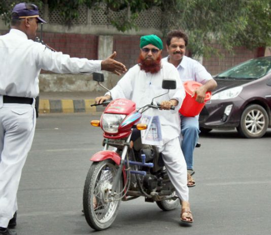 'No Helmet, No Entry' on Karachi's I.I Chundrigar Road